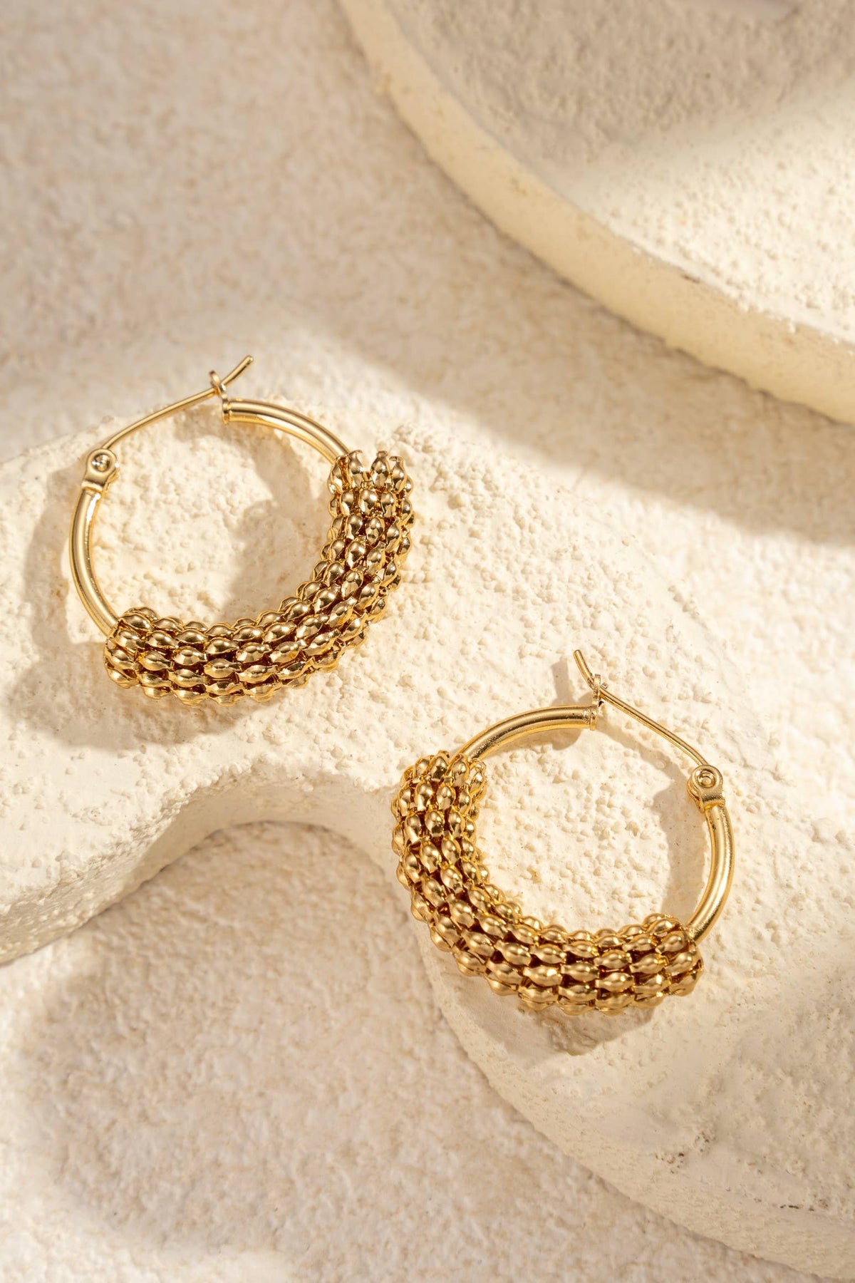 Trendy textured golden stainless steel hoop earrings